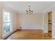 Traditional dining room with hardwood floors and a large window for ample natural light at 3474 Castleridge Dr, Tucker, GA 30084