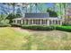 Charming brick home featuring manicured landscaping and a well-maintained front yard at 3474 Castleridge Dr, Tucker, GA 30084