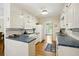 Bright kitchen with blue tile countertops, white cabinets, and stainless steel appliances at 3474 Castleridge Dr, Tucker, GA 30084