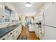 Charming kitchen featuring ample cabinet space, stainless appliances, and a view to the breakfast area at 3474 Castleridge Dr, Tucker, GA 30084