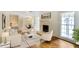 Living room virtually staged with hardwood floors, a fireplace, and built-in shelving at 3474 Castleridge Dr, Tucker, GA 30084