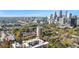 Stunning aerial view showcases the city skyline, lush green trees, and the surrounding neighborhood at 375 Ralph Mcgill Ne Blvd # 502, Atlanta, GA 30312