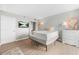 Cozy bedroom featuring hardwood floors, a TV, a dresser and an open closet at 375 Ralph Mcgill Ne Blvd # 502, Atlanta, GA 30312