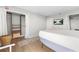 Bright bedroom featuring hardwood floors, a TV, and open closets with shelving at 375 Ralph Mcgill Ne Blvd # 502, Atlanta, GA 30312