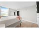 Bright bedroom featuring hardwood floors, a TV, and a mirrored closet at 375 Ralph Mcgill Ne Blvd # 502, Atlanta, GA 30312