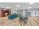 Inviting resident common room with a comfortable turquoise sofa, dining table, and bookshelf for leisure at 375 Ralph Mcgill Ne Blvd # 502, Atlanta, GA 30312