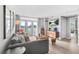 Inviting living room with a comfortable sofa, stylish furniture, and bright natural light from the balcony doors at 375 Ralph Mcgill Ne Blvd # 502, Atlanta, GA 30312
