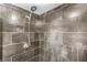 Walk-in shower featuring modern fixtures and tiled walls at 375 Ralph Mcgill Ne Blvd # 502, Atlanta, GA 30312