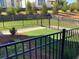 Enclosed backyard with black metal fencing and newly planted greenery for privacy at 634 Skytop Dr # 155, Cumming, GA 30040
