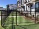 New black metal fenced yard with fresh sod and landscaping at 634 Skytop Dr # 155, Cumming, GA 30040