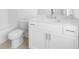 Bathroom with a white vanity, toilet, tub, and modern fixtures at 634 Skytop Dr # 155, Cumming, GA 30040