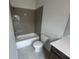 Modern bathroom features gray tiling in shower and vanity with dark wood finish at 634 Skytop Dr # 155, Cumming, GA 30040