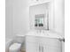 Bright bathroom featuring a white vanity, toilet, and tub with subway tile at 634 Skytop Dr # 155, Cumming, GA 30040