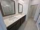 The primary bathroom has a double vanity with quartz countertop and tile floor at 634 Skytop Dr # 155, Cumming, GA 30040