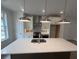 A kitchen featuring a large island, pendant lighting, stainless steel appliances, and stylish range hood at 634 Skytop Dr # 155, Cumming, GA 30040