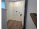 A laundry room with tile floor, wire shelving, and hookups is conveniently located on the second floor at 634 Skytop Dr # 155, Cumming, GA 30040