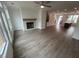 The living room features a fireplace, an open floor plan, and hardwood floors at 634 Skytop Dr # 155, Cumming, GA 30040