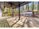 Large wooden back deck with lighting and view of the large backyard at 2267 Bryant Dr, East Point, GA 30344