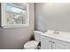 Bathroom with a white sink and vanity next to a window at 2267 Bryant Dr, East Point, GA 30344