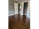Bedroom featuring a walk in closet, hardwood floors, and gray walls at 2267 Bryant Dr, East Point, GA 30344