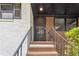 Close up view of a metal security door leading to the entrance, with stairs and metal railings at 2267 Bryant Dr, East Point, GA 30344