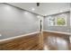 Open living room featuring hardwood floors, gray walls, recessed lighting, and natural light from a window at 2267 Bryant Dr, East Point, GA 30344