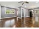 Spacious living room with hardwood floors, gray walls, ceiling fan, and open access to the kitchen at 2267 Bryant Dr, East Point, GA 30344