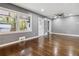 Living area with hardwood floors, gray walls, a window, and a door leading to the outside at 2267 Bryant Dr, East Point, GA 30344