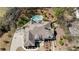 Overhead view of a home and property, showcasing a large roof, long driveway, and lush green landscaping at 3720 River Mansion Dr, Peachtree Corners, GA 30096