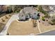 Aerial view of home featuring a well-maintained yard and long private drive at 3720 River Mansion Dr, Peachtree Corners, GA 30096