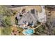 Large home with an in-ground pool, patio seating, and a meticulously landscaped backyard at 3720 River Mansion Dr, Peachtree Corners, GA 30096