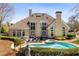 Backyard pool with spa, lounge chairs, and a well-manicured lawn at 3720 River Mansion Dr, Peachtree Corners, GA 30096