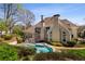 Spacious backyard with in-ground pool, landscaping, and outdoor seating at 3720 River Mansion Dr, Peachtree Corners, GA 30096