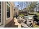Landscaped backyard with brick patio, in-ground pool, and ample seating at 3720 River Mansion Dr, Peachtree Corners, GA 30096