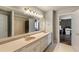 This bathroom features double sinks, ample counter space, and large mirrors, offering style and function at 3720 River Mansion Dr, Peachtree Corners, GA 30096