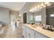 Bright bathroom featuring double sinks, a soaking tub, and a separate shower at 3720 River Mansion Dr, Peachtree Corners, GA 30096