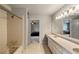 This bathroom features double sinks, ample counter space, a bathtub, and large mirrors, offering style and function at 3720 River Mansion Dr, Peachtree Corners, GA 30096