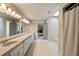 Bathroom with double vanity, long mirror, and tiled flooring at 3720 River Mansion Dr, Peachtree Corners, GA 30096