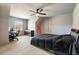 Inviting bedroom with neutral walls, cozy carpet, ceiling fan, and desk area, ideal for comfortable living at 3720 River Mansion Dr, Peachtree Corners, GA 30096