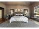 Beautiful primary bedroom with a gray color scheme and decorative patterned rug at 3720 River Mansion Dr, Peachtree Corners, GA 30096