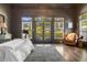 Bright primary bedroom featuring large windows and a patterned rug at 3720 River Mansion Dr, Peachtree Corners, GA 30096