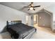 Inviting bedroom with neutral walls, cozy carpet, ceiling fan, and desk area, ideal for comfortable living at 3720 River Mansion Dr, Peachtree Corners, GA 30096