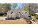 Beautiful home with manicured lawn, professional landscaping, and mature trees at 3720 River Mansion Dr, Peachtree Corners, GA 30096