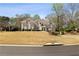 Beautiful two-story home with a well-manicured lawn and mature trees, offering great curb appeal at 3720 River Mansion Dr, Peachtree Corners, GA 30096