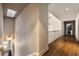 Hallway with hardwood floors and skylight, with a staircase visible on the left at 3720 River Mansion Dr, Peachtree Corners, GA 30096