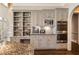 Custom kitchen featuring built-in shelving, stainless steel appliances, and a granite countertop at 3720 River Mansion Dr, Peachtree Corners, GA 30096