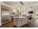 Bright kitchen with a large island, granite countertops, and stainless steel appliances at 3720 River Mansion Dr, Peachtree Corners, GA 30096