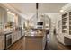 Gourmet kitchen with granite island, custom cabinets, and stainless steel appliances at 3720 River Mansion Dr, Peachtree Corners, GA 30096