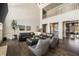 Open-concept living room featuring a balcony, high ceilings, and seamless flow to the dining area at 3720 River Mansion Dr, Peachtree Corners, GA 30096