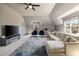 Spacious living room with large sectional couch, TV, and natural lighting at 3720 River Mansion Dr, Peachtree Corners, GA 30096